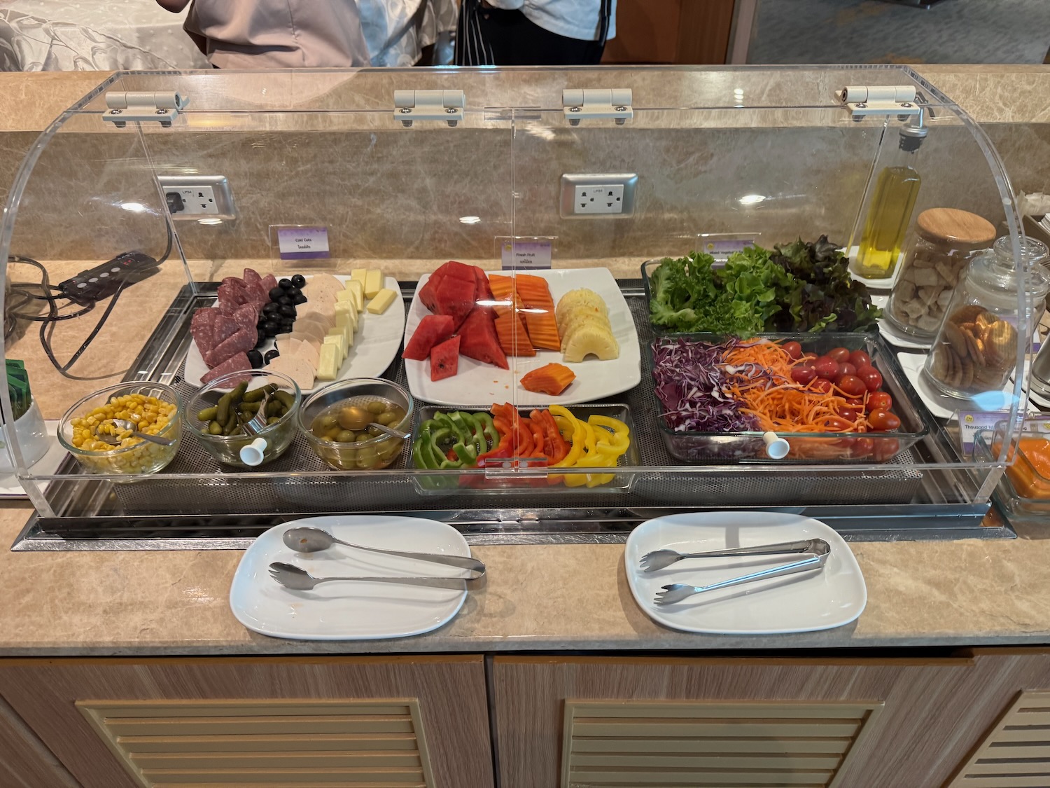 a buffet with different food items on it