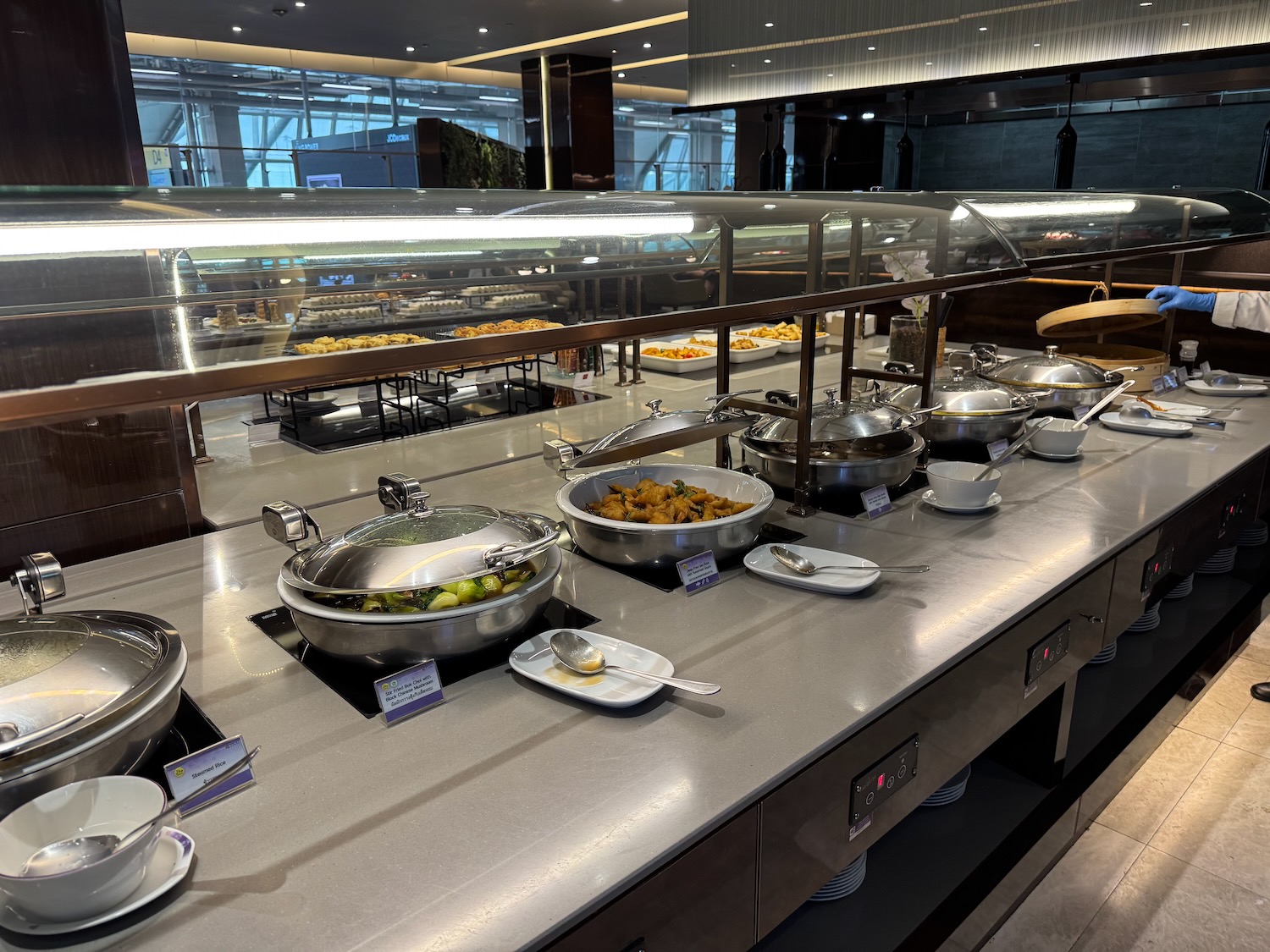 a buffet line with food in bowls