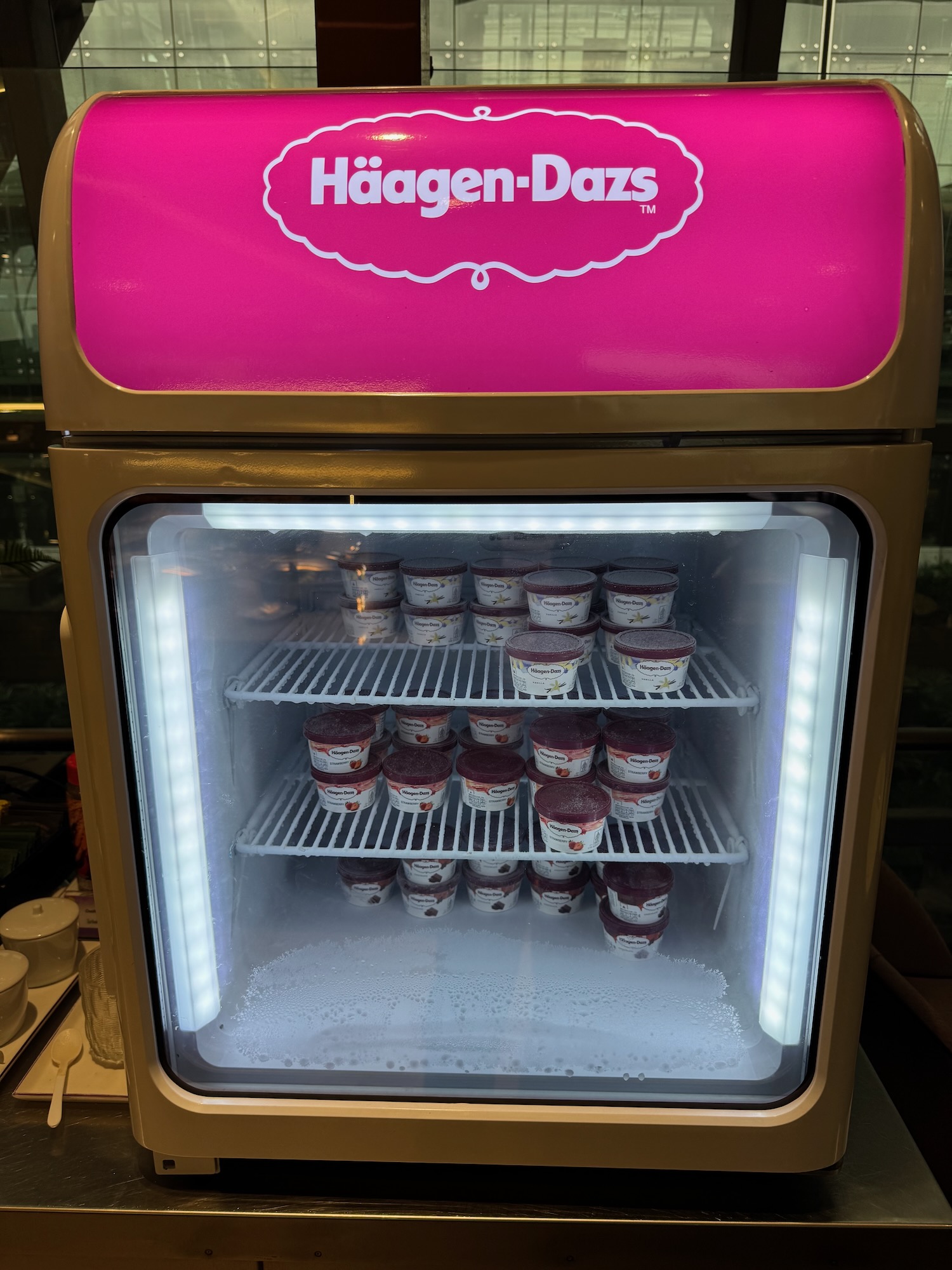 a freezer with ice cream in it