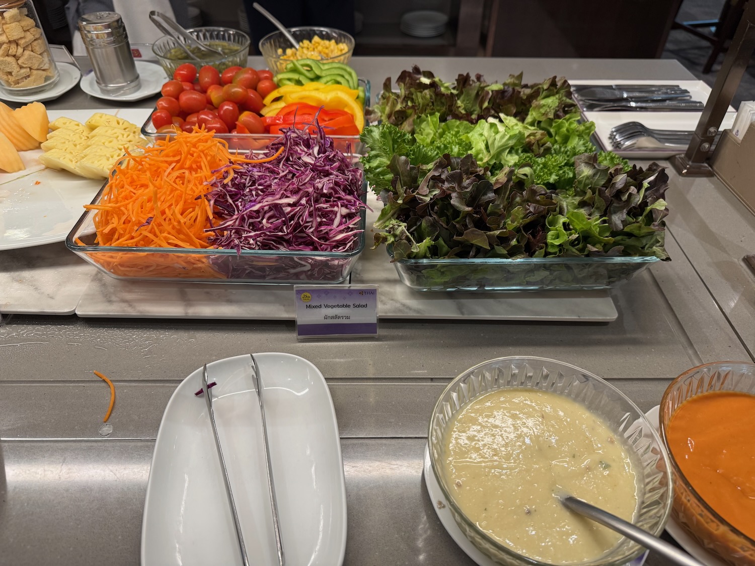 a salad bar with different types of vegetables