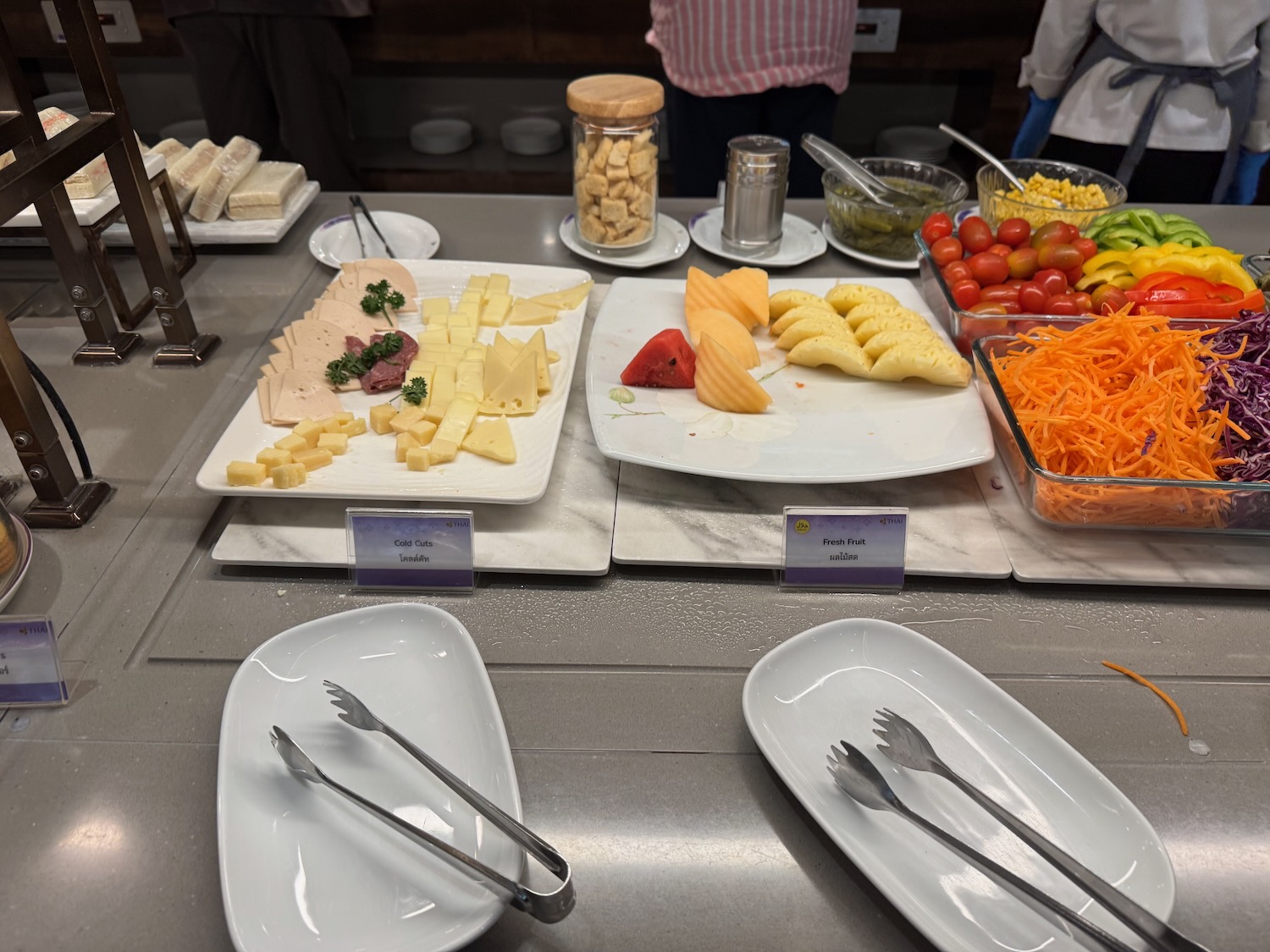 a table with plates of food and forks