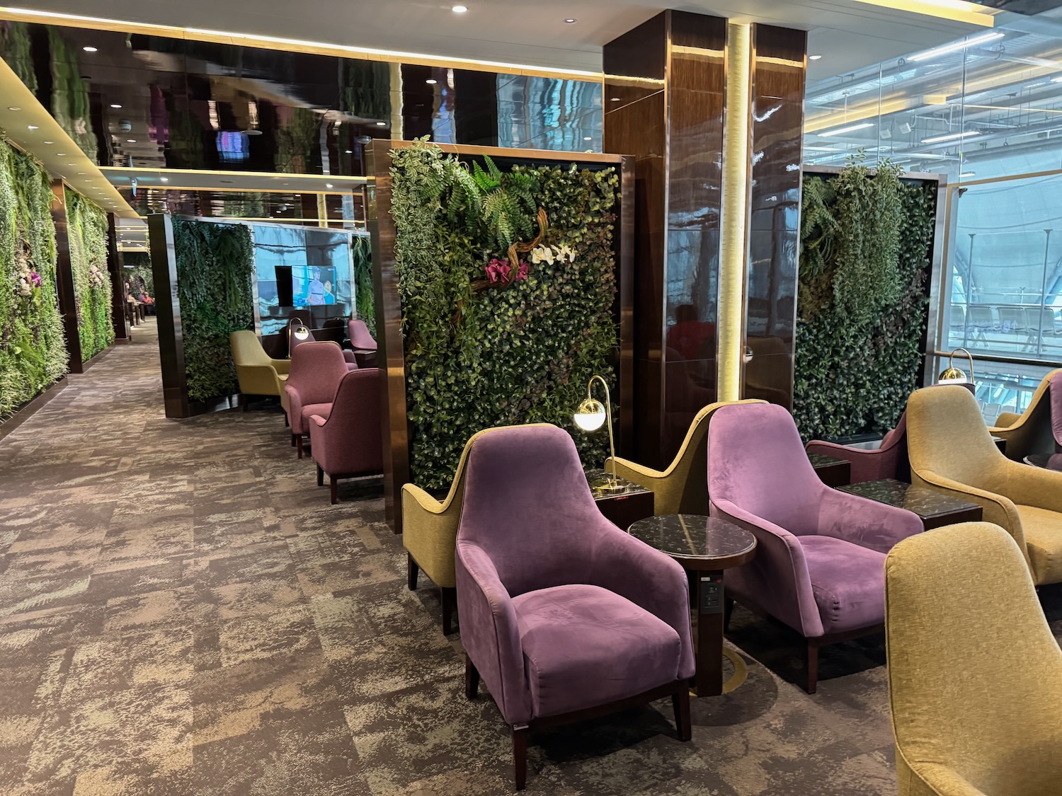 a room with chairs and plants