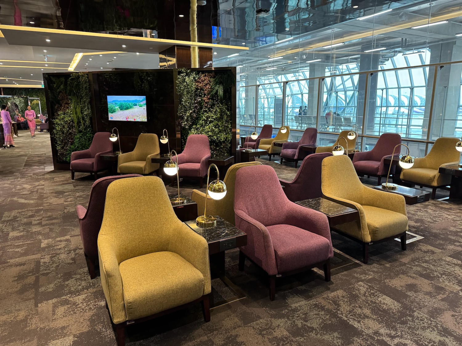 a room with chairs and a television