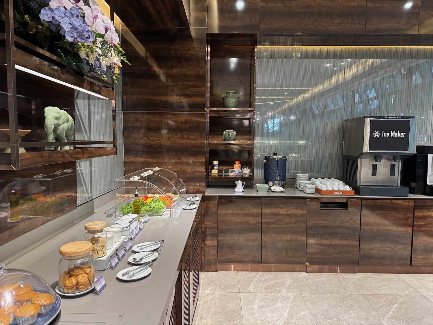 a kitchen with a counter and shelves