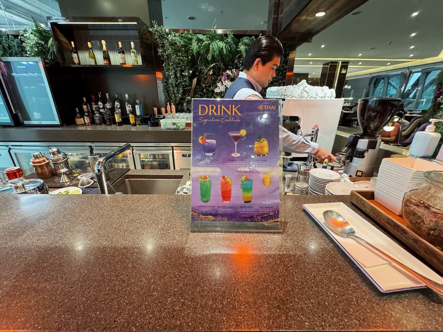 a man standing behind a counter
