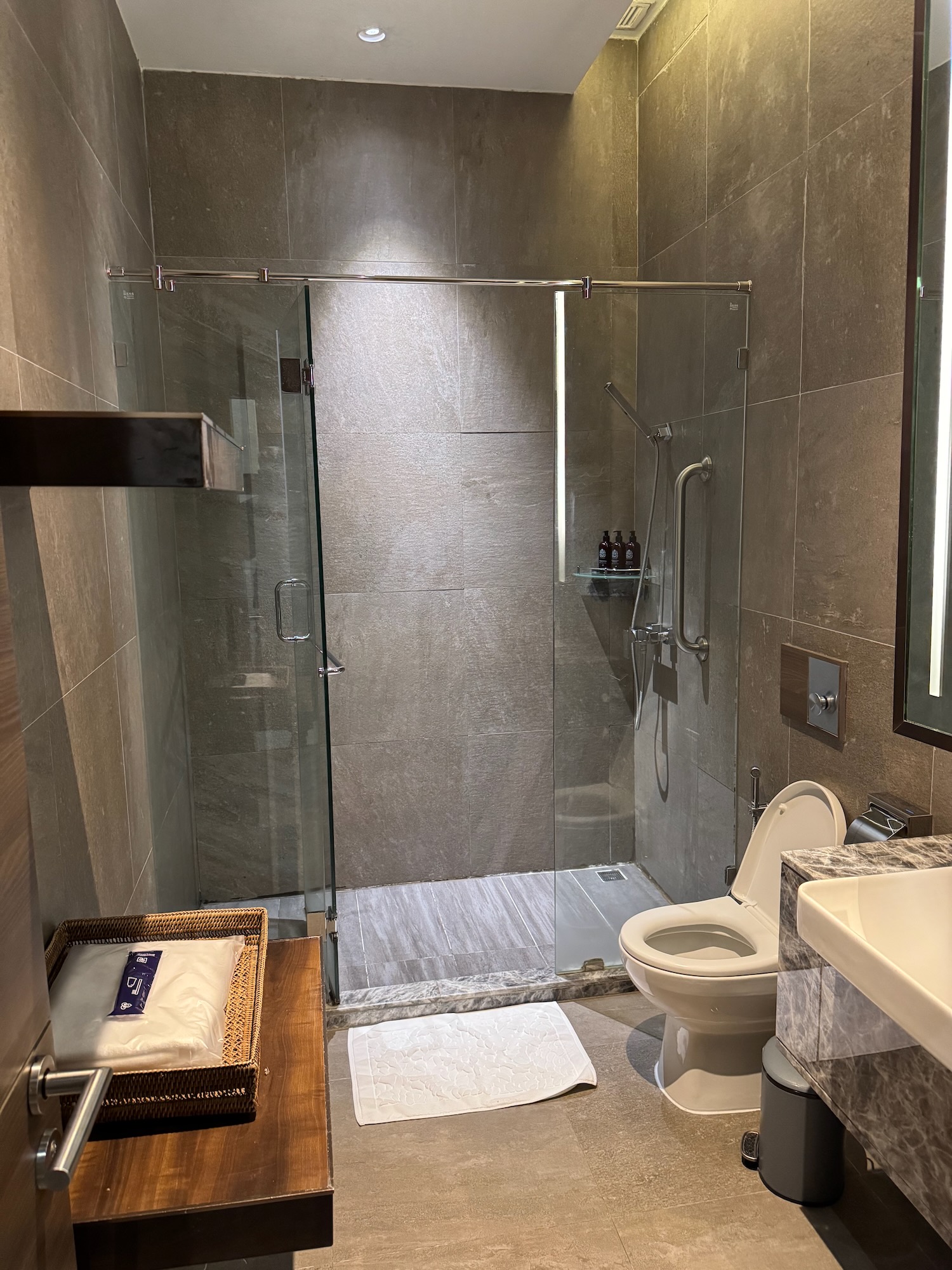 a bathroom with a glass shower door