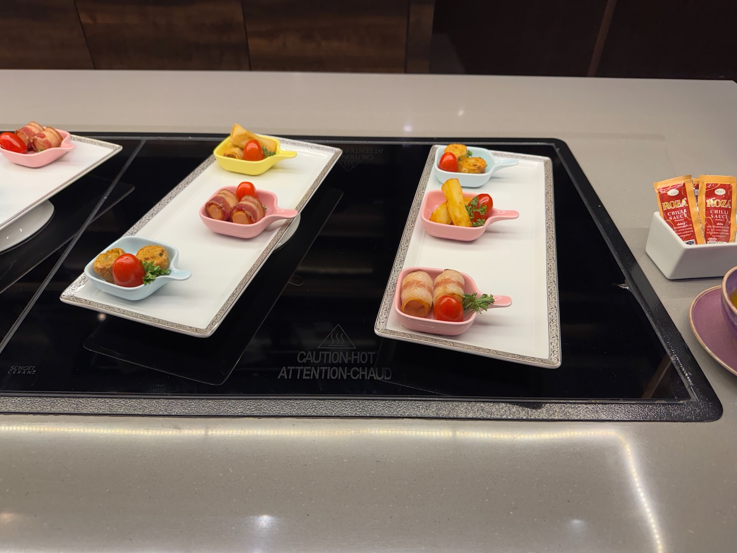 a trays of food on a stove top