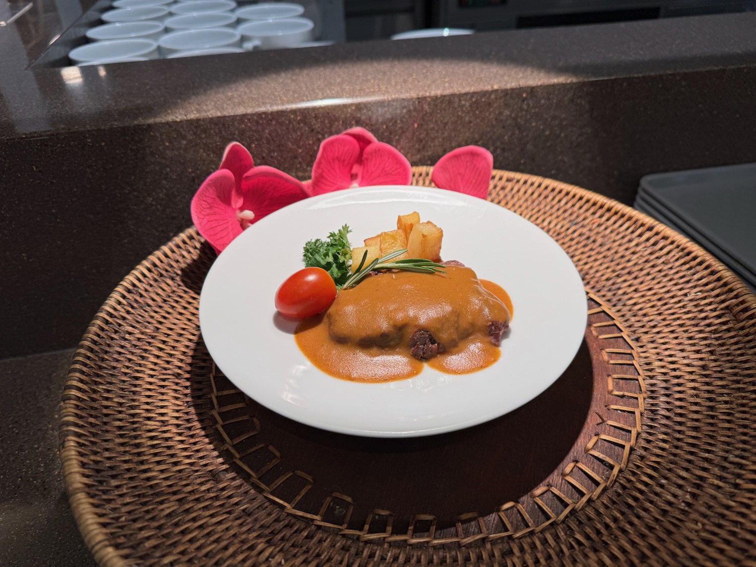 a plate of food on a wicker tray