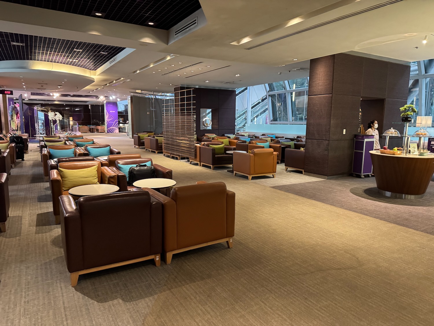 a room with many chairs and tables