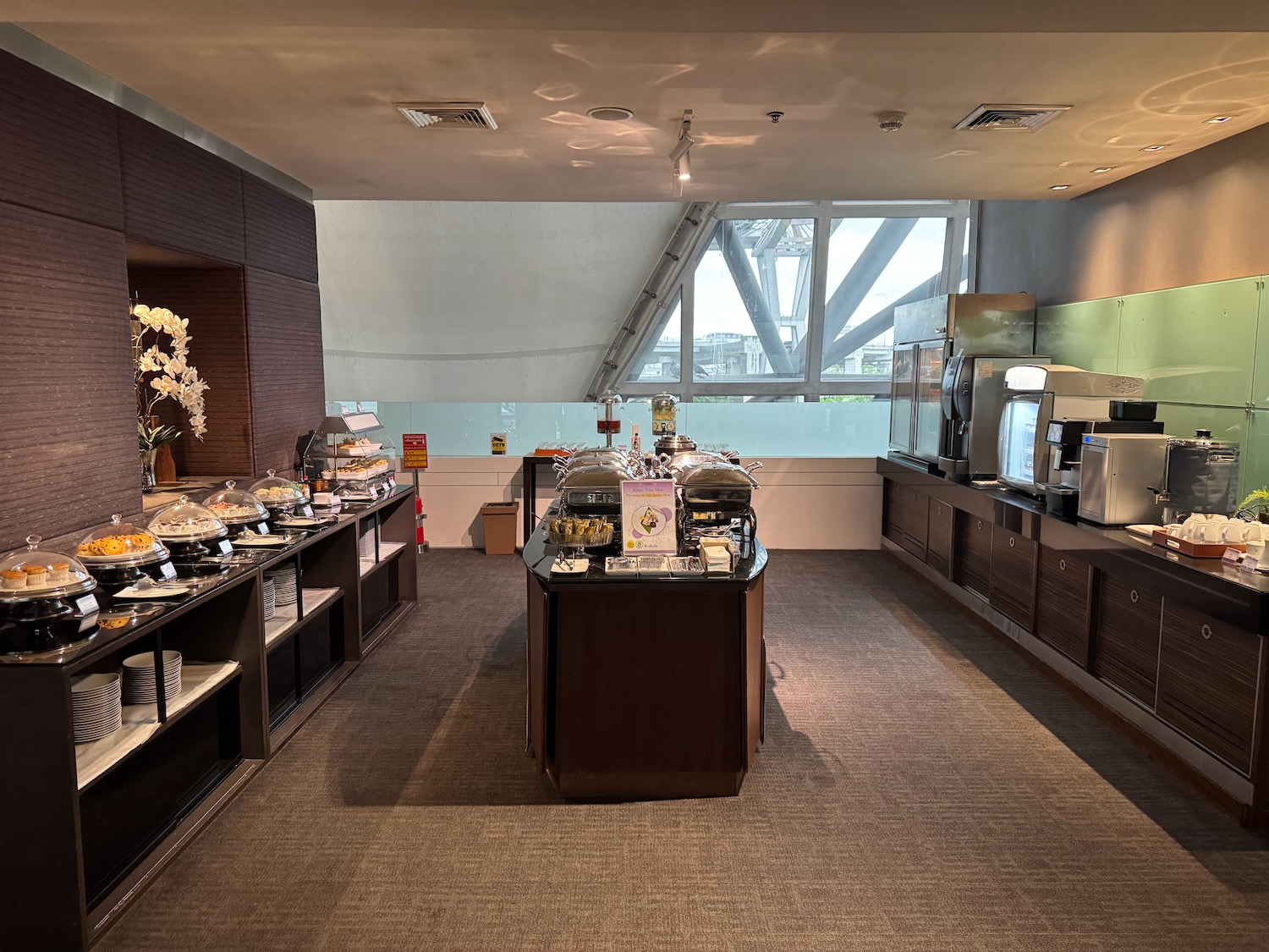 a room with a buffet and a window