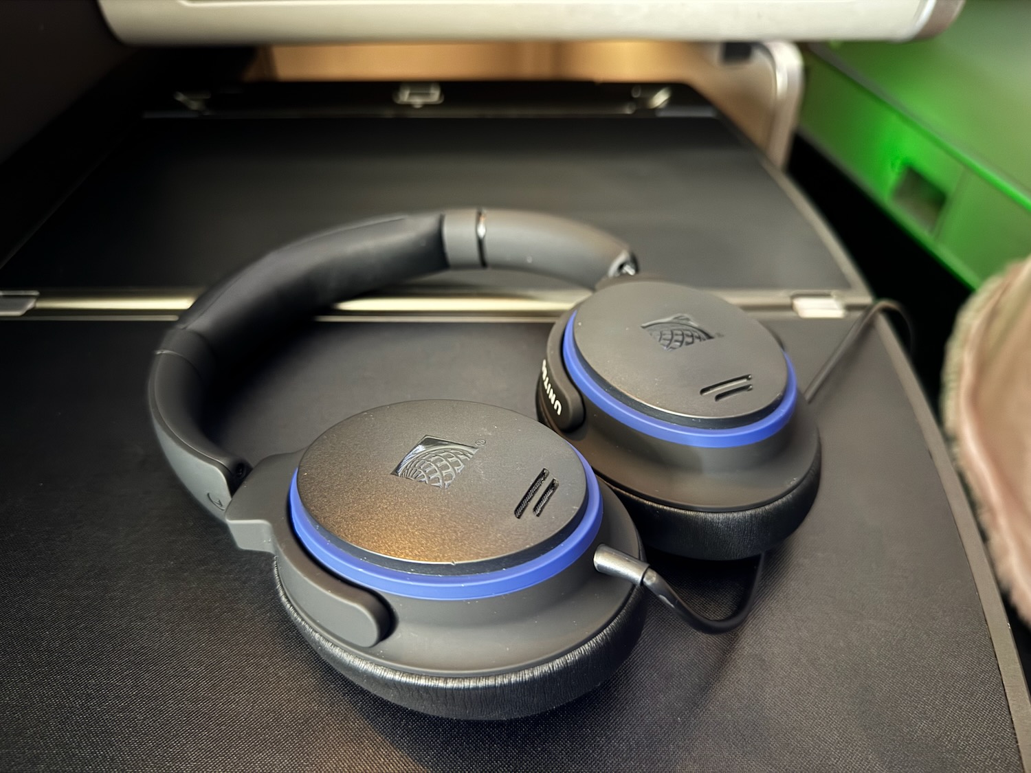 a pair of headphones on a black surface