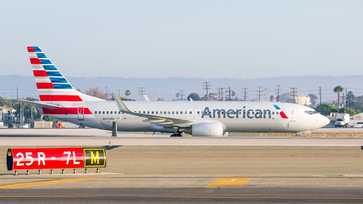a white airplane on a runway