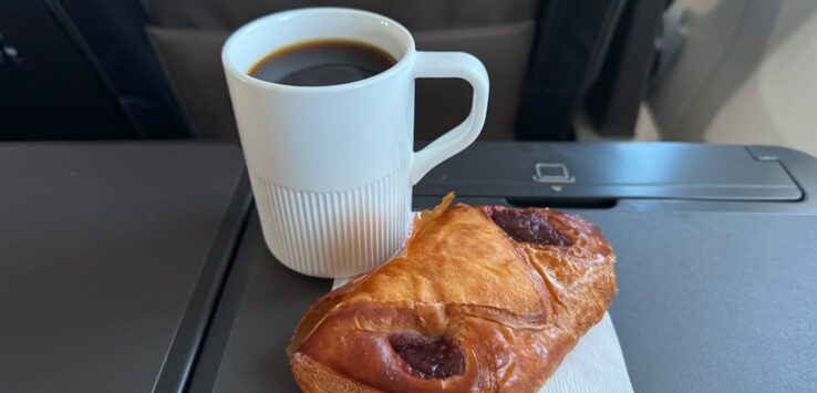 a pastry and a cup of coffee
