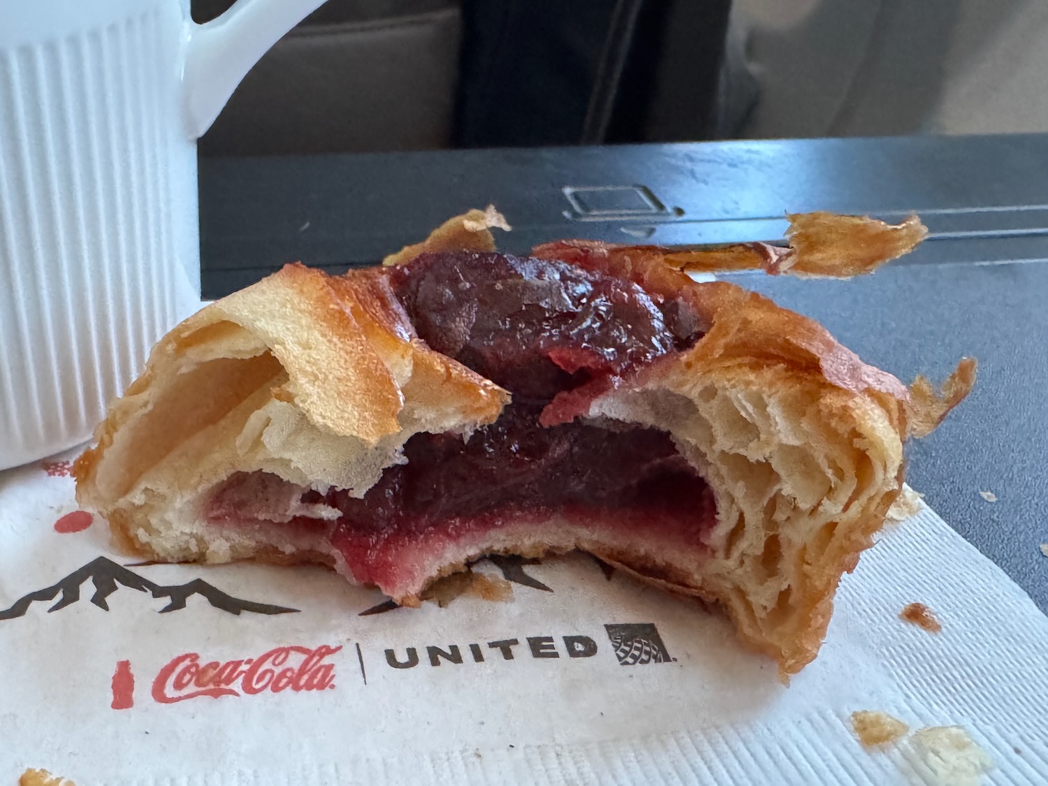 a half eaten pastry on a napkin