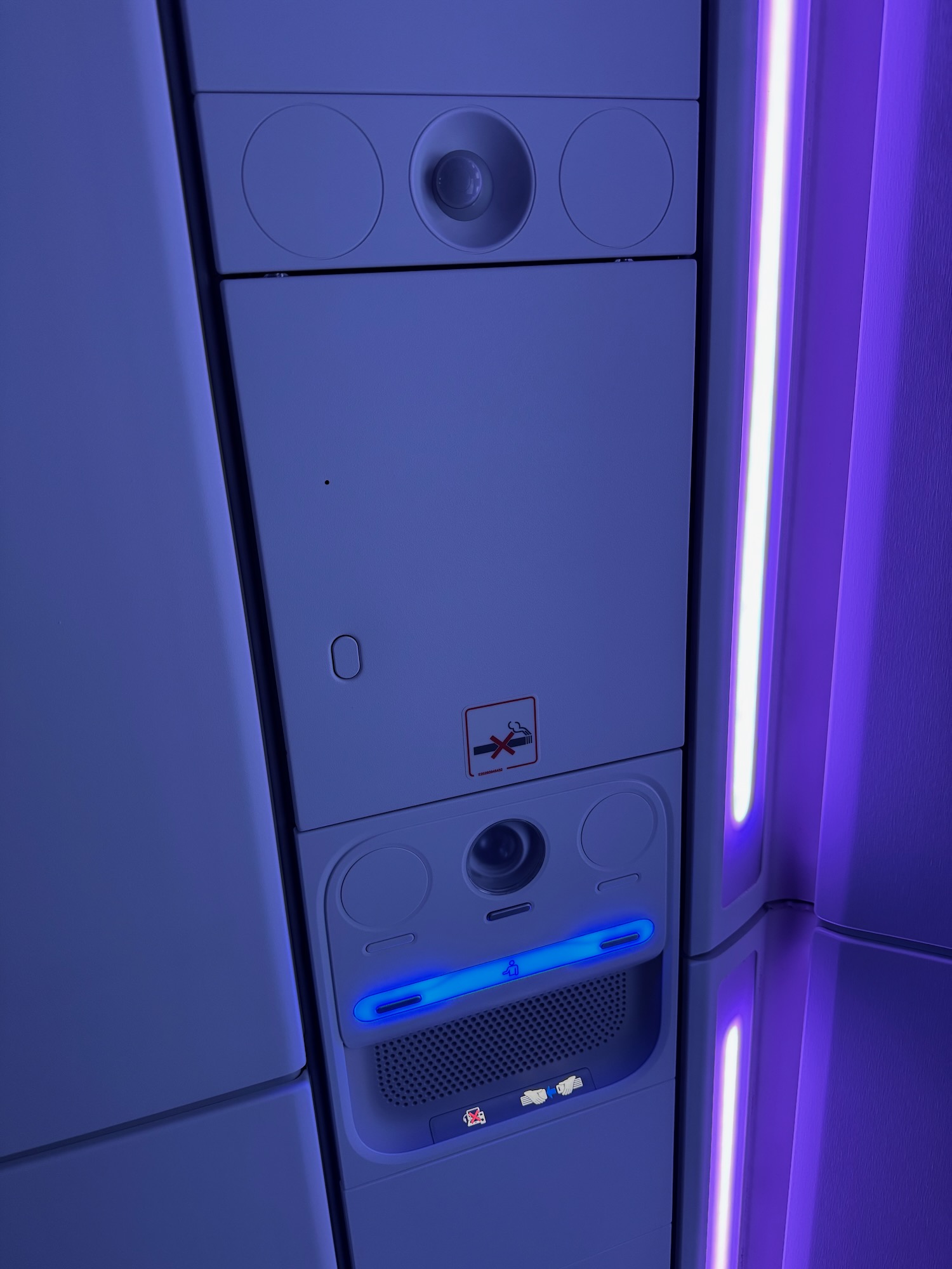 a white rectangular object with a blue light