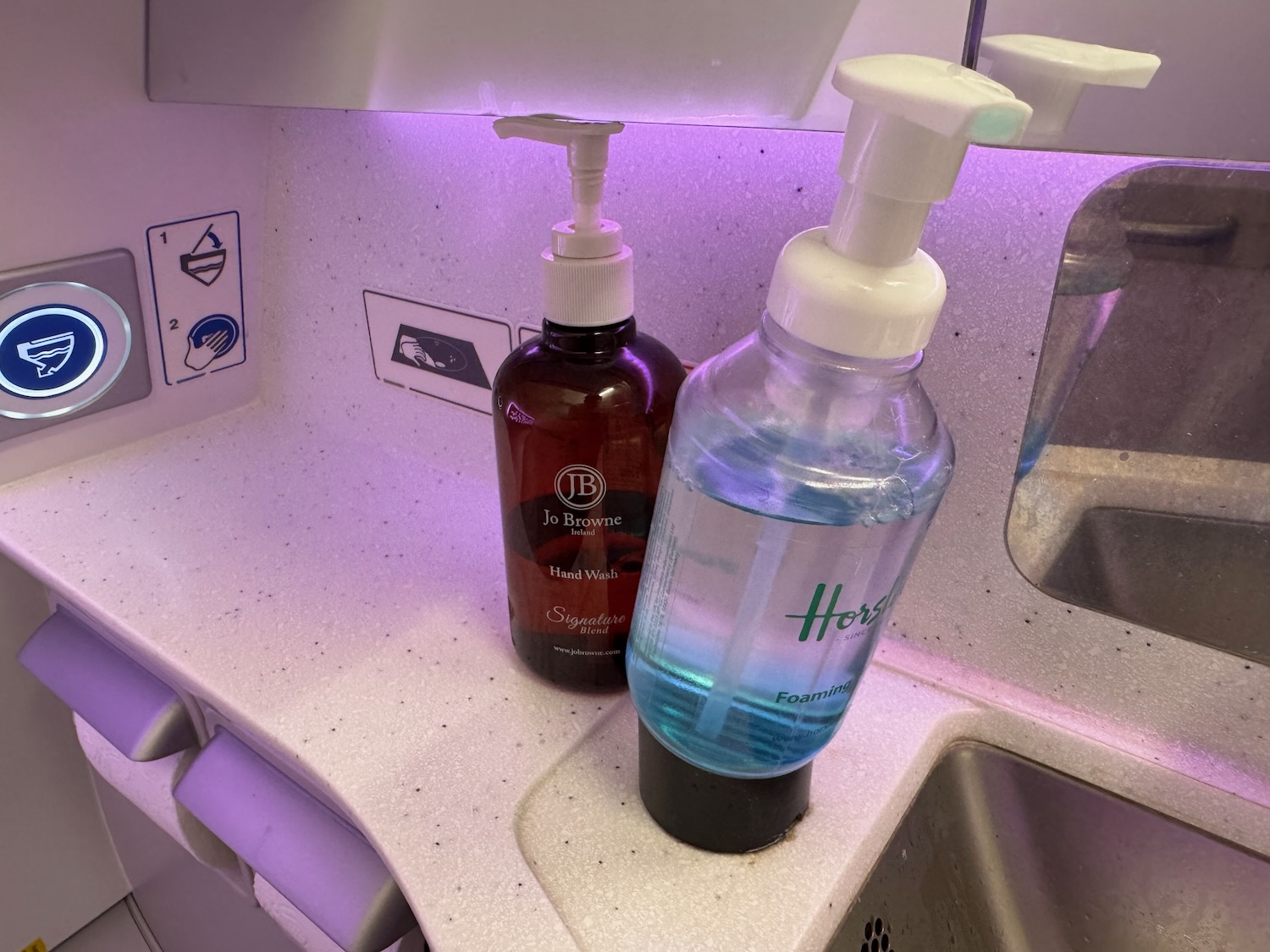 a couple of soap dispensers on a counter