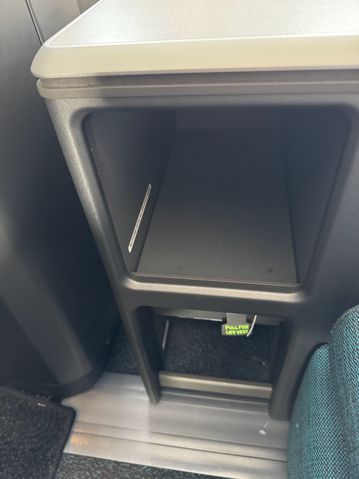 a small black shelf in a vehicle