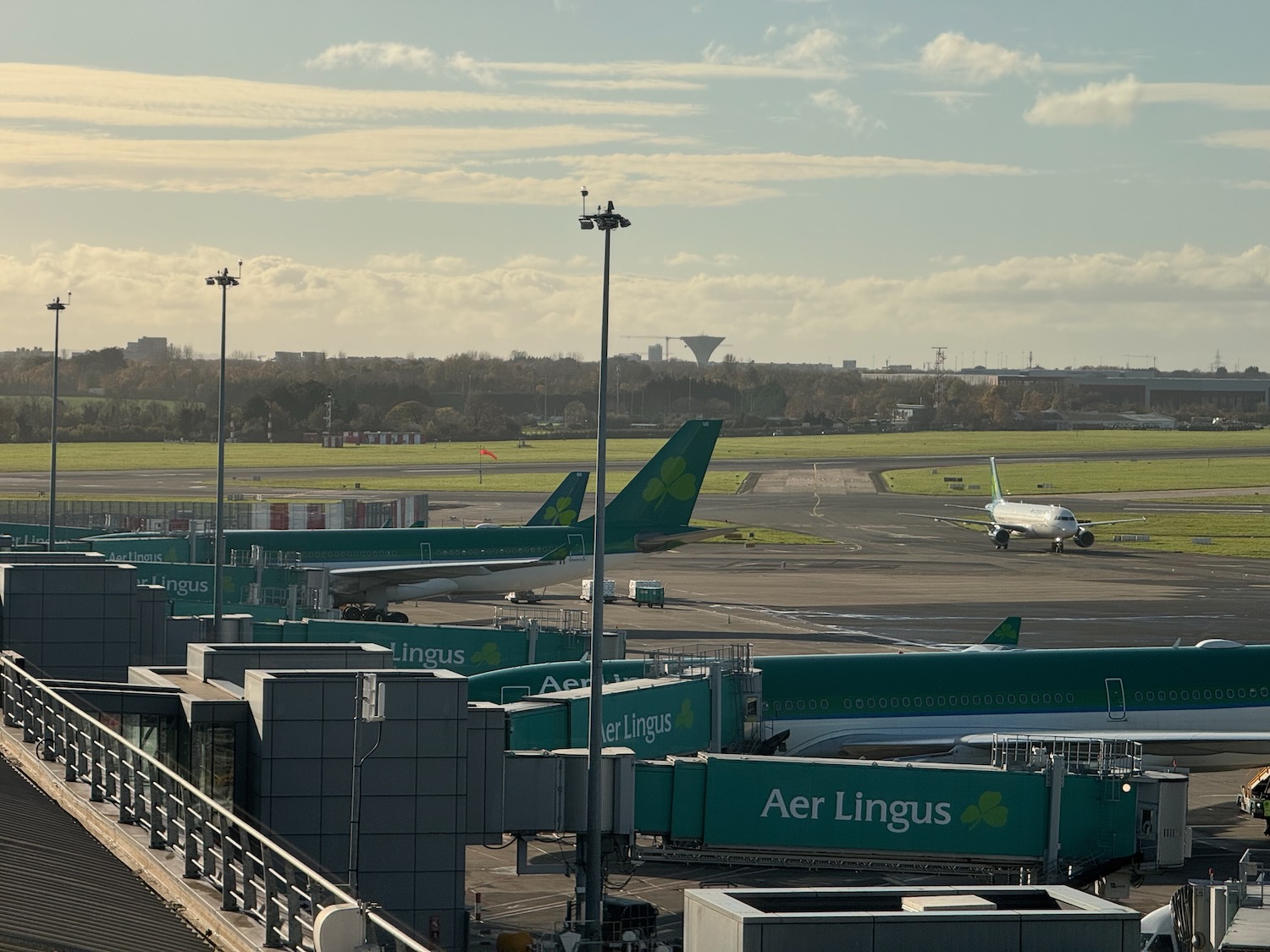 an airport with airplanes on the runway