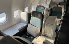 the inside of an airplane with seats and windows