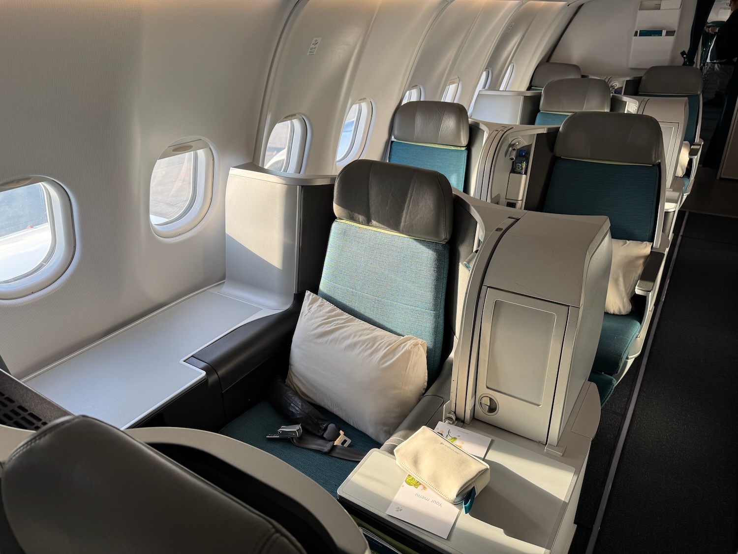 the inside of an airplane with seats and windows