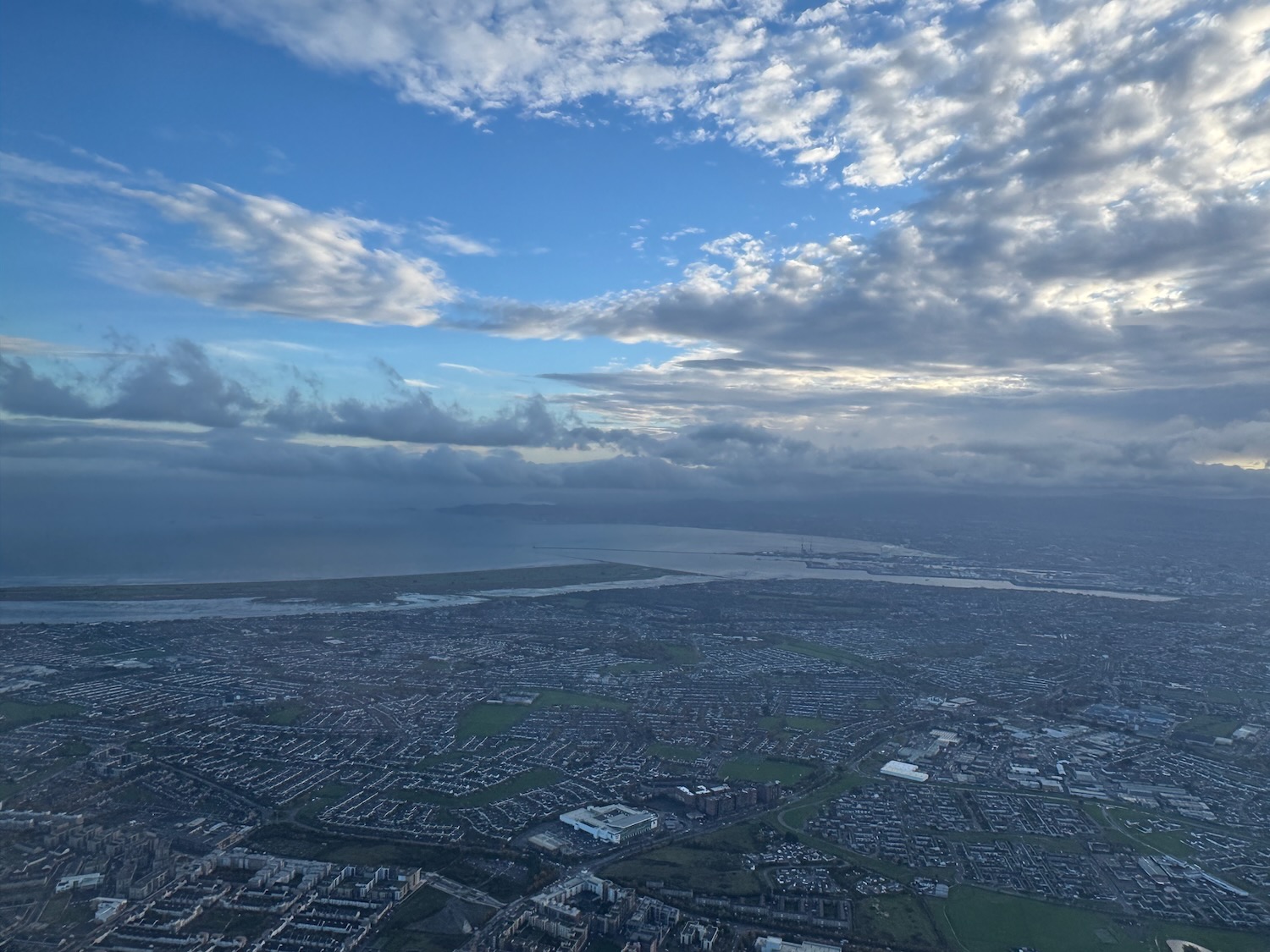 aerial view of a city and water from a plane
