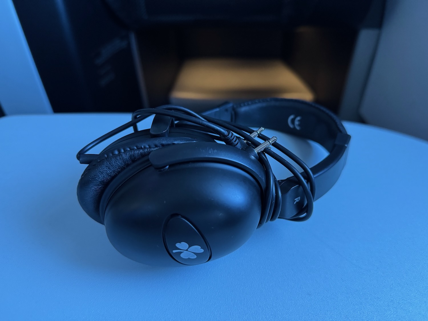 a black headphones on a white surface