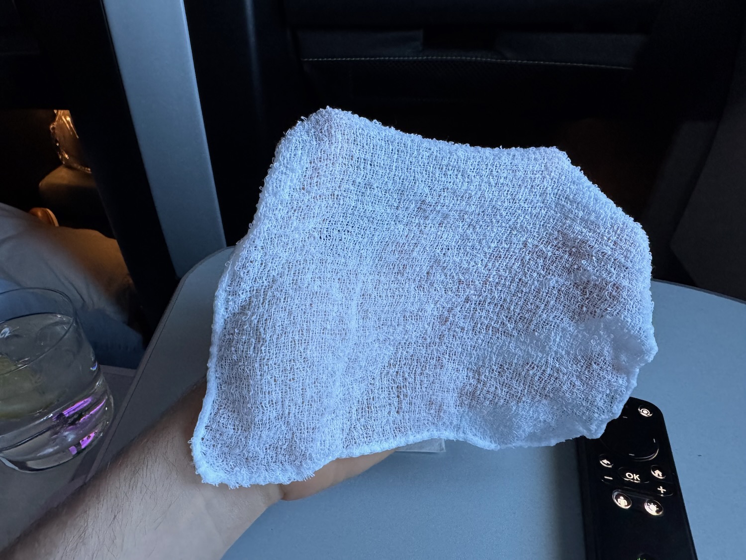 a hand holding a white towel