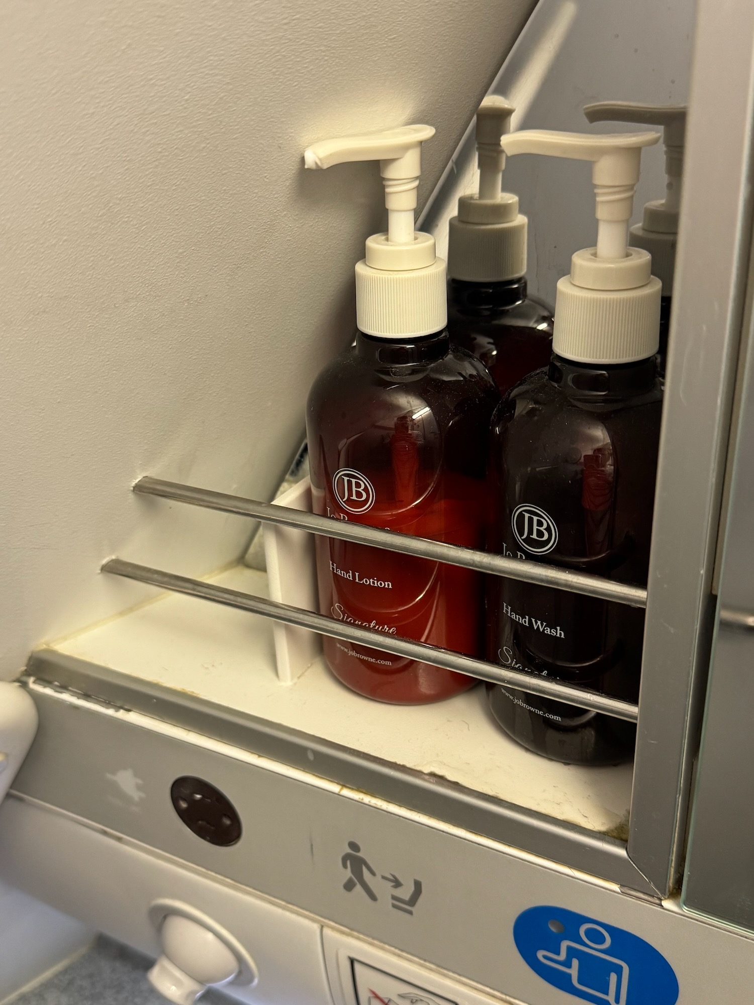 a group of soap dispensers on a shelf