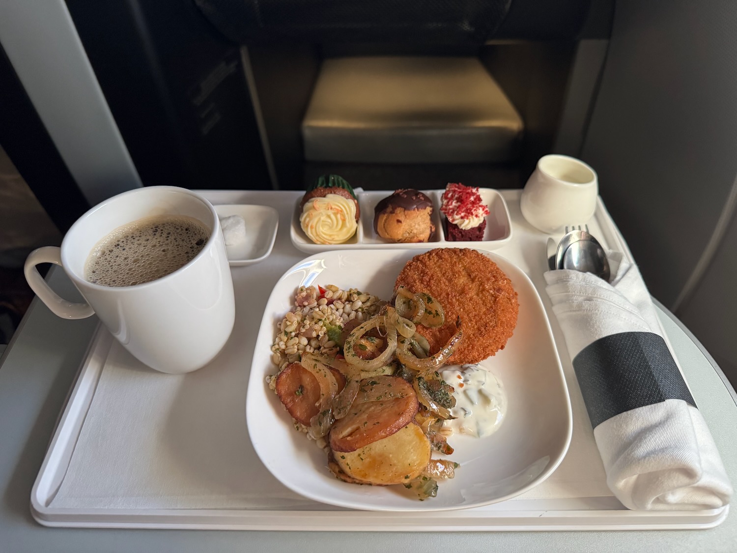 a tray with food and a cup of coffee