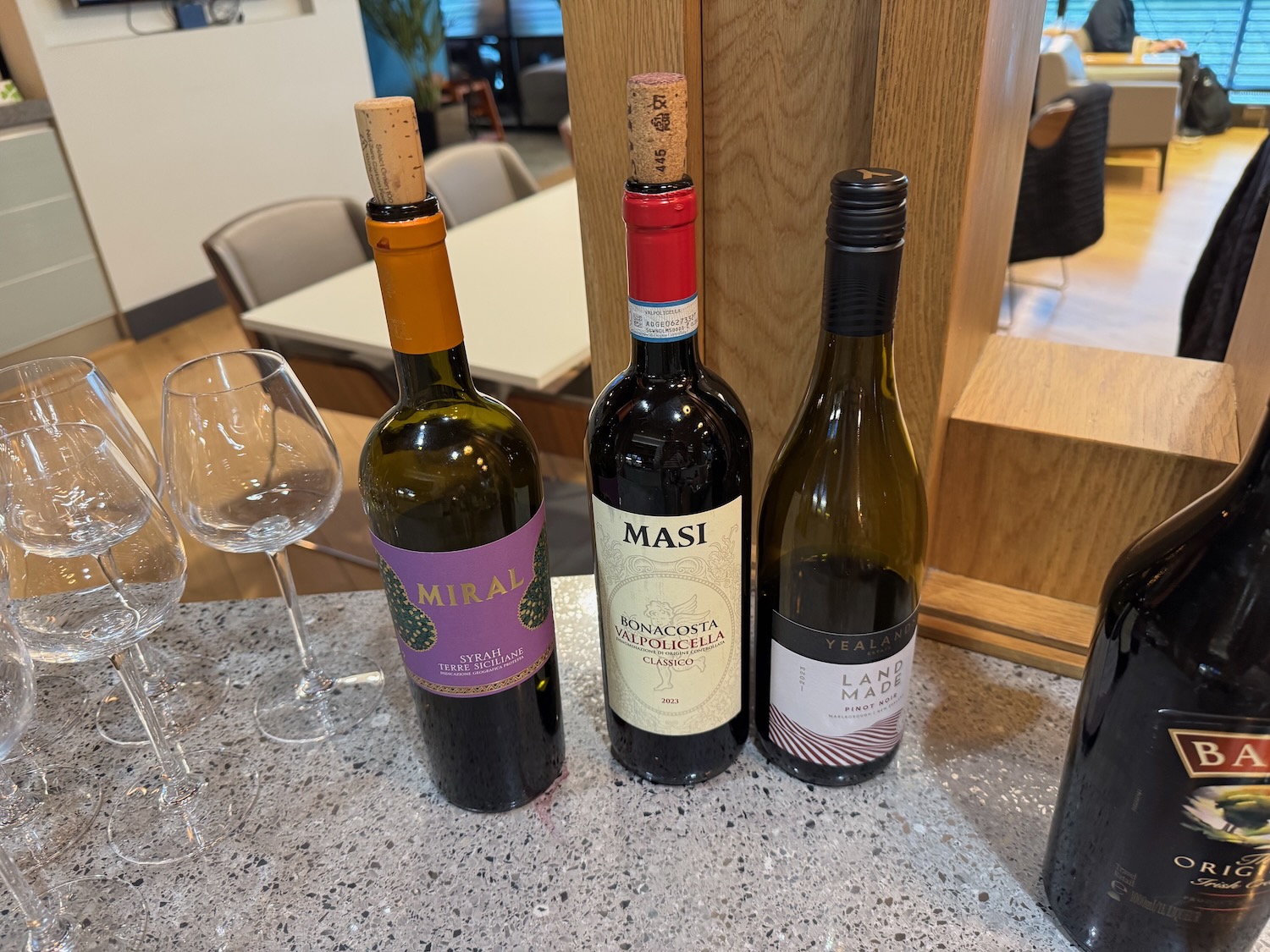 a group of wine bottles on a counter