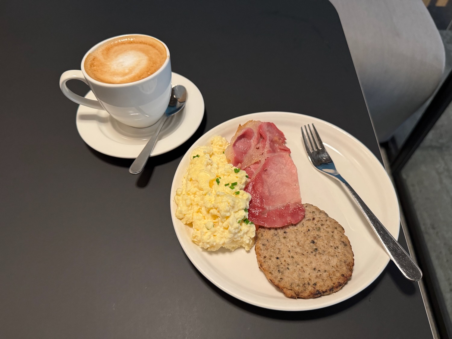 a plate of food and a cup of coffee