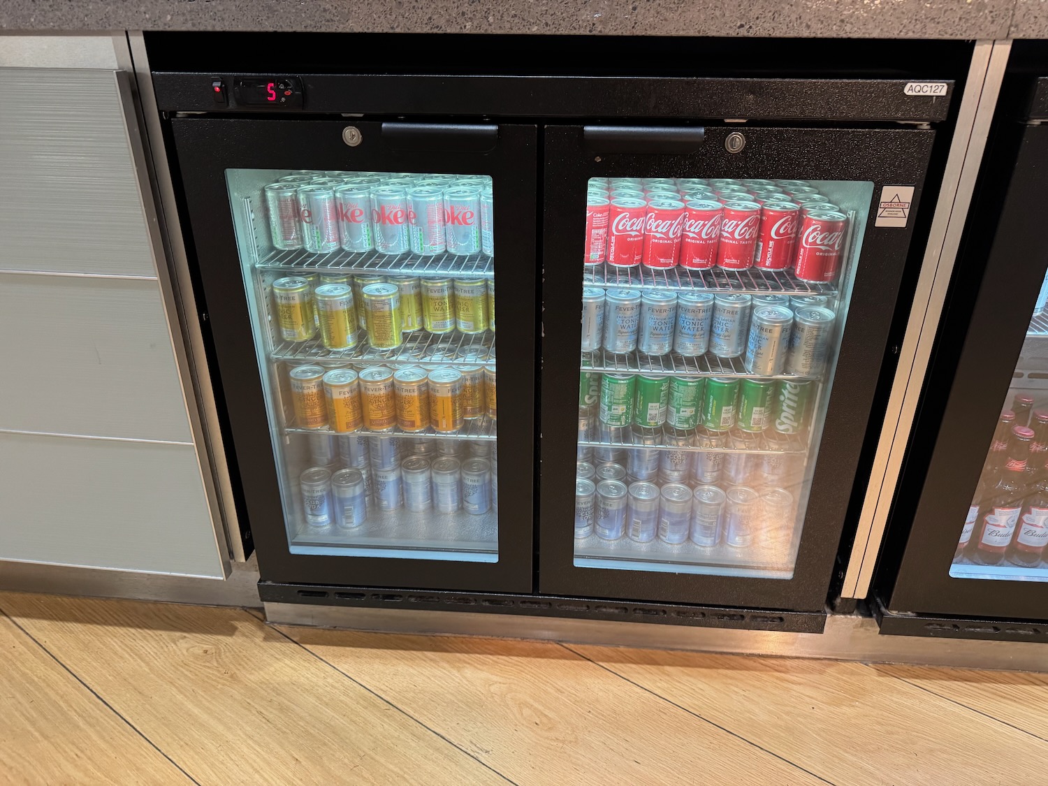 a beverage cooler with cans in it