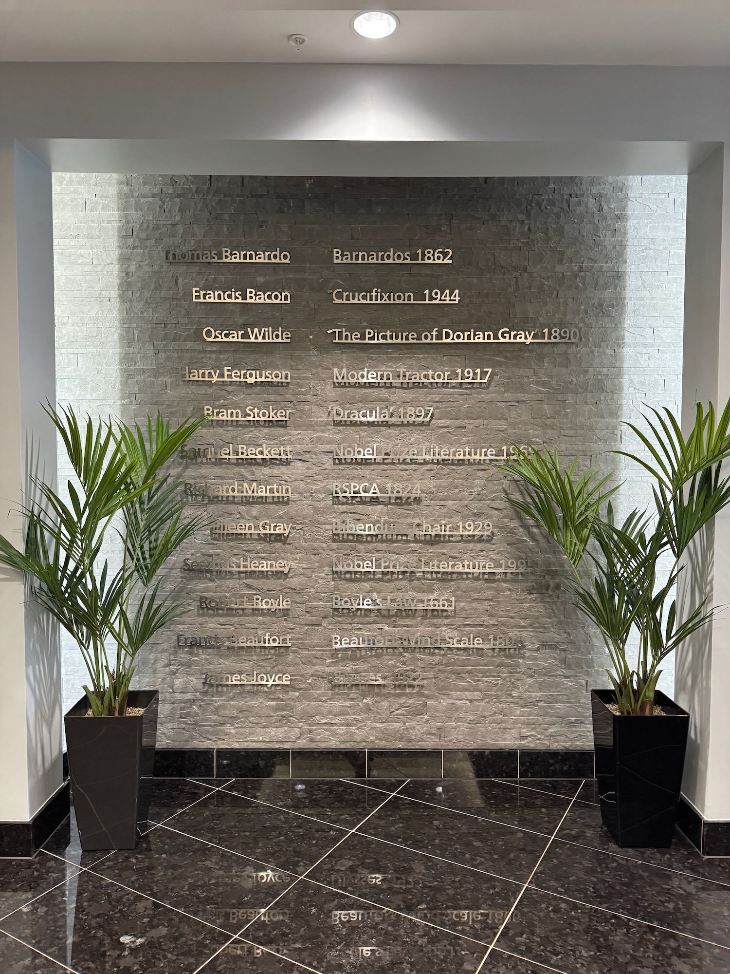 a wall with plants in pots