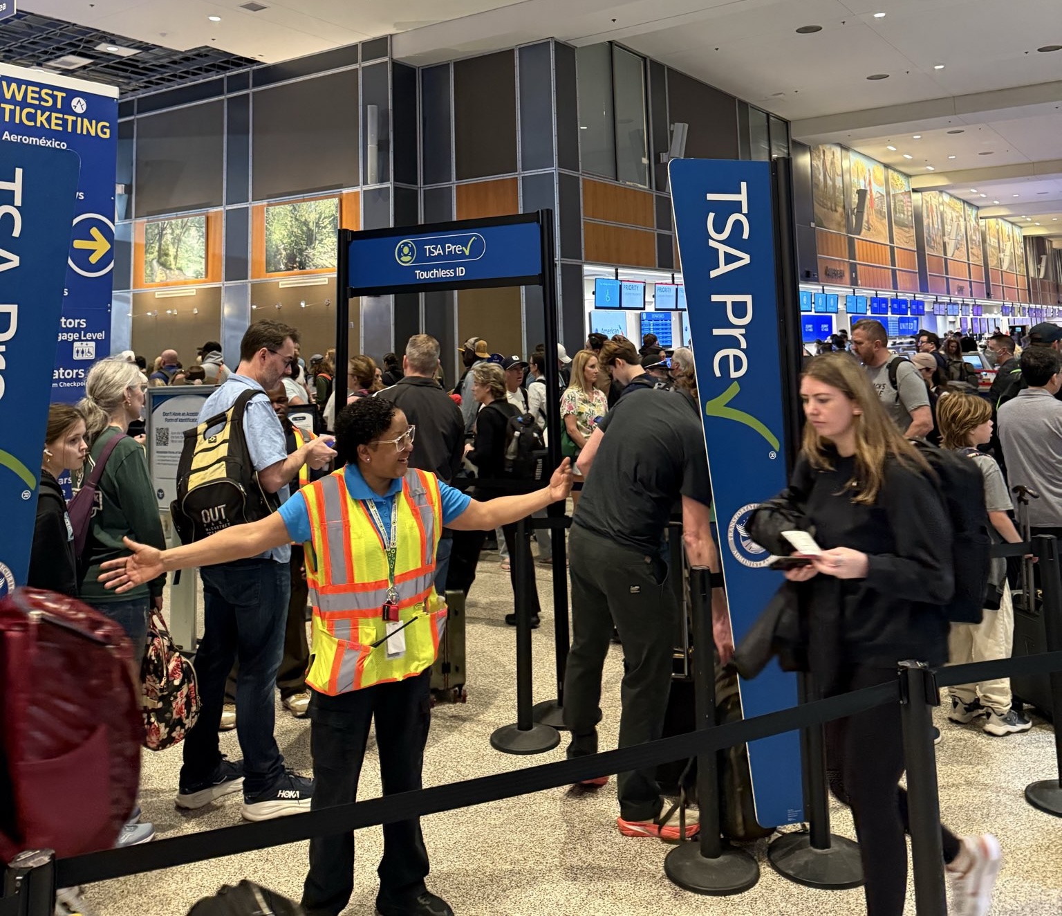 a group of people in an airport