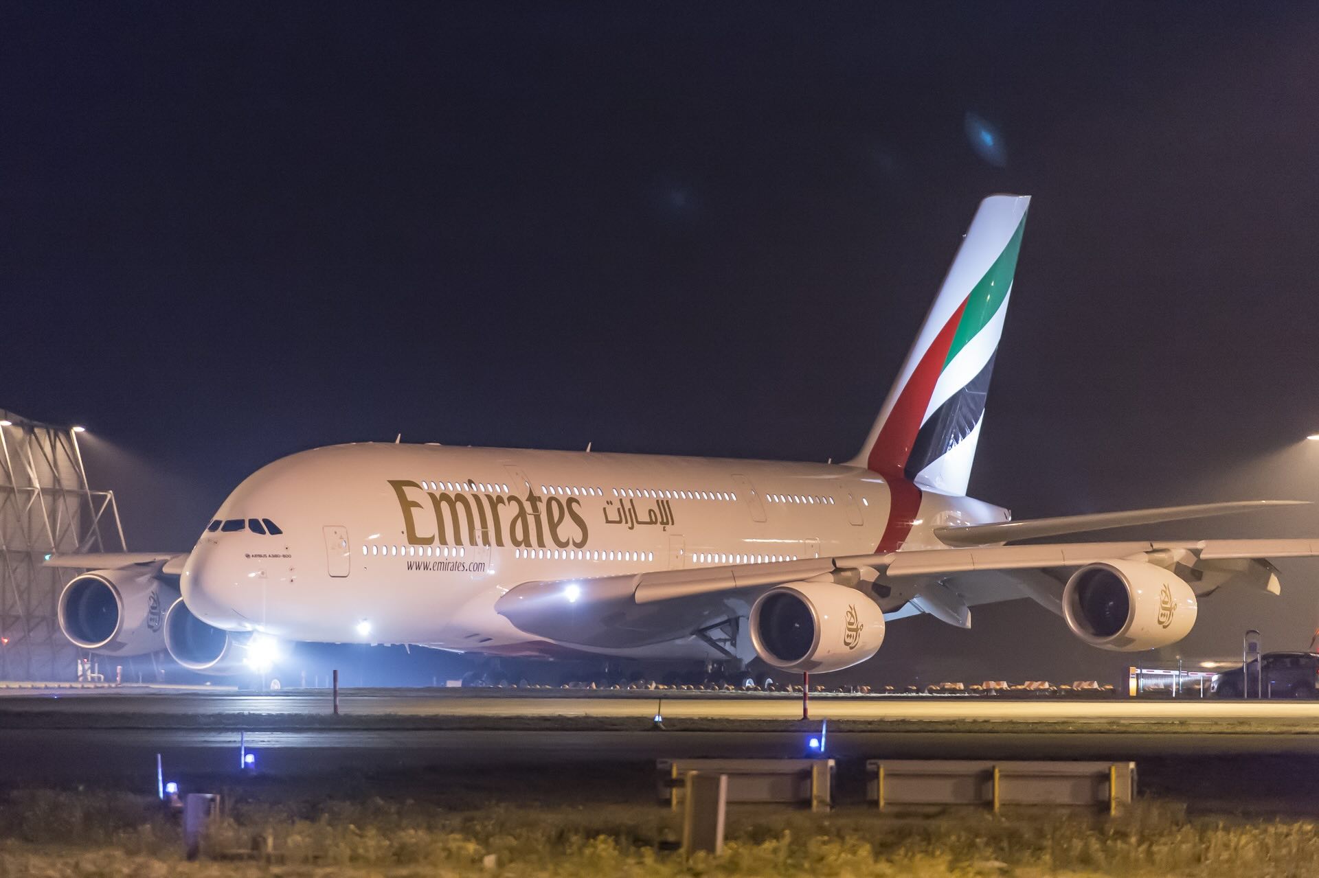 an airplane on a runway at night
