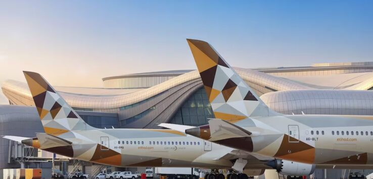 a large airplane parked in front of a building