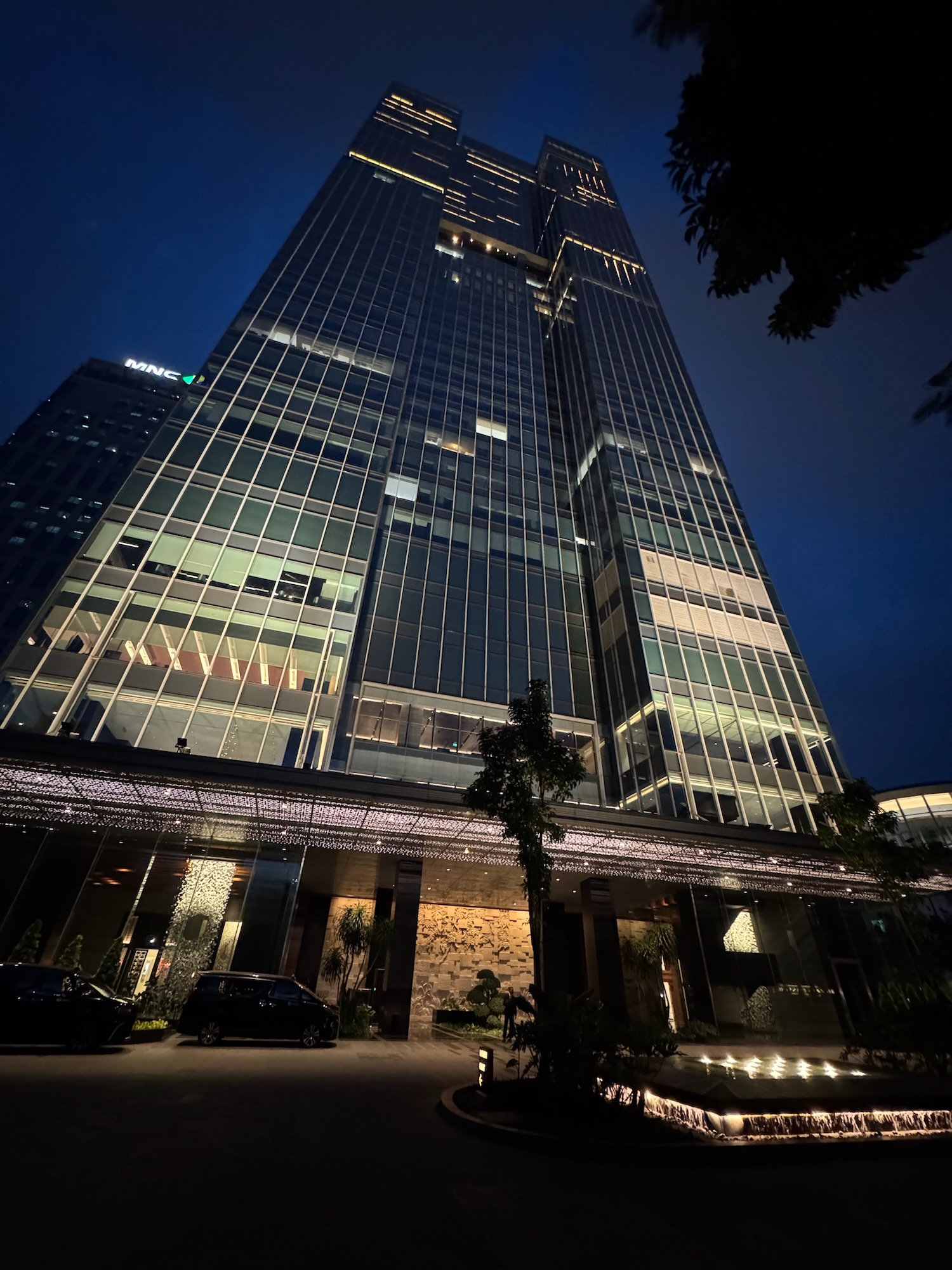 a tall building with lights at night