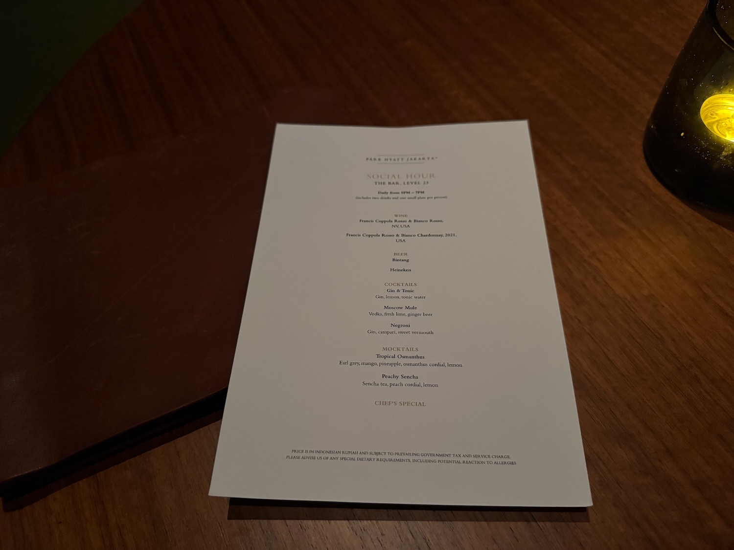 a white paper on a wood surface