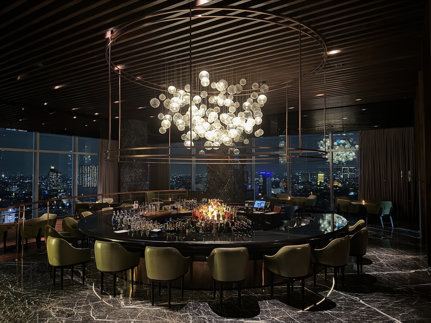 a large round table with a chandelier over it