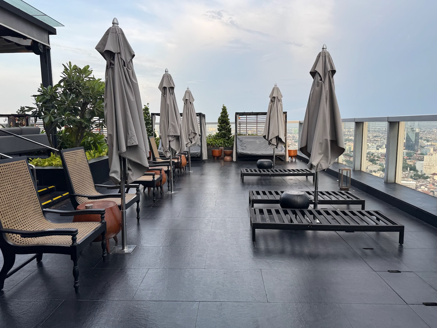 a patio with chairs and umbrellas