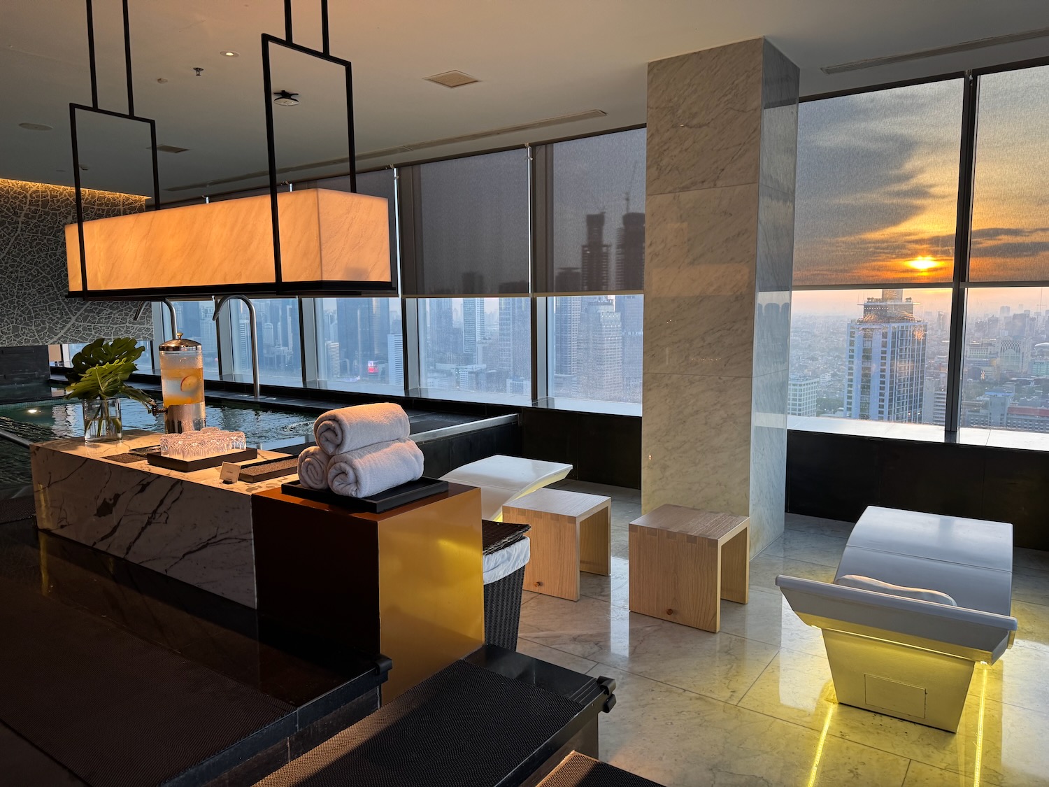 a room with a view of a city and a skyscraper