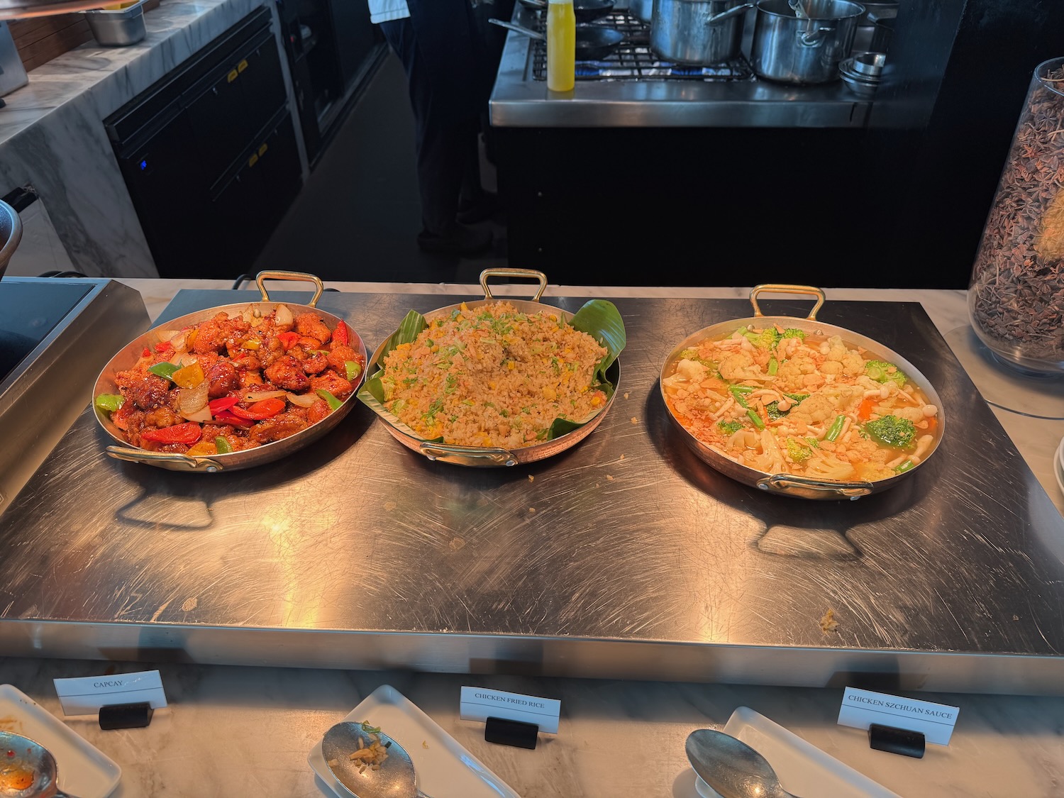 a group of bowls of food on a counter