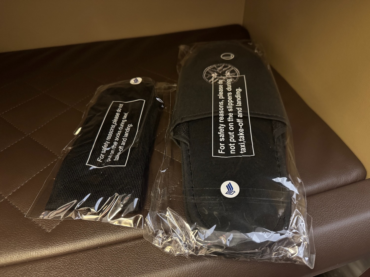a black case and black strap in plastic wrap
