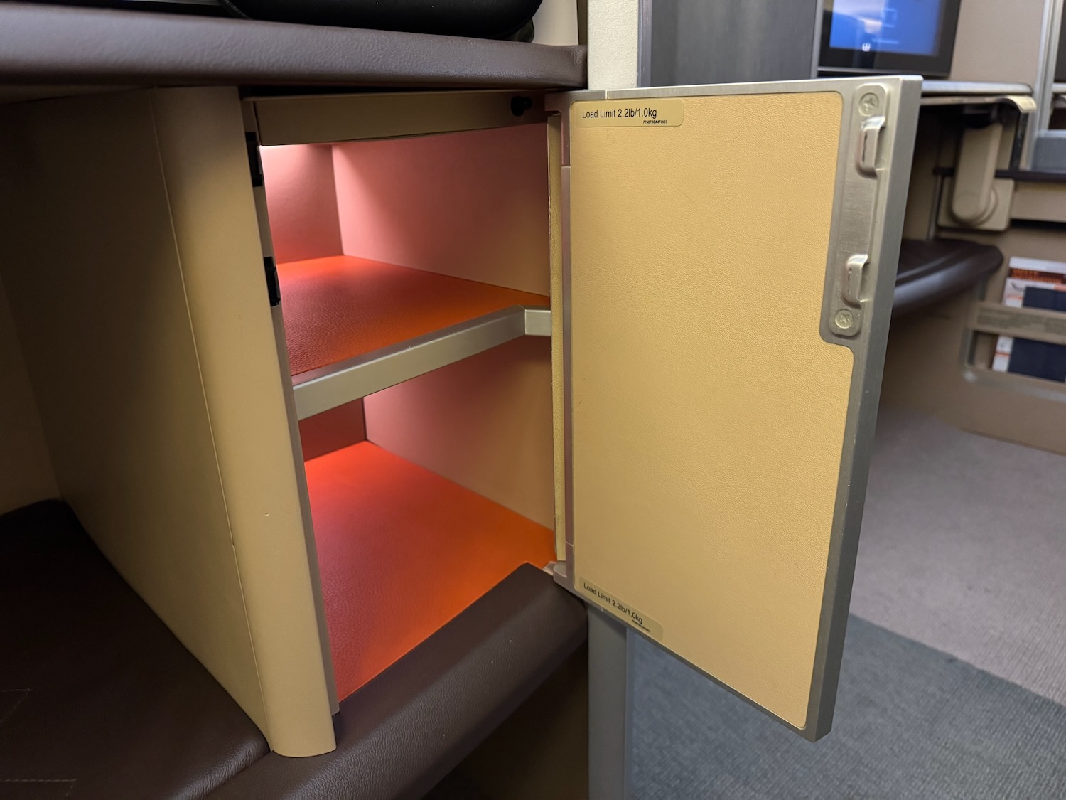 an open shelf with a light inside