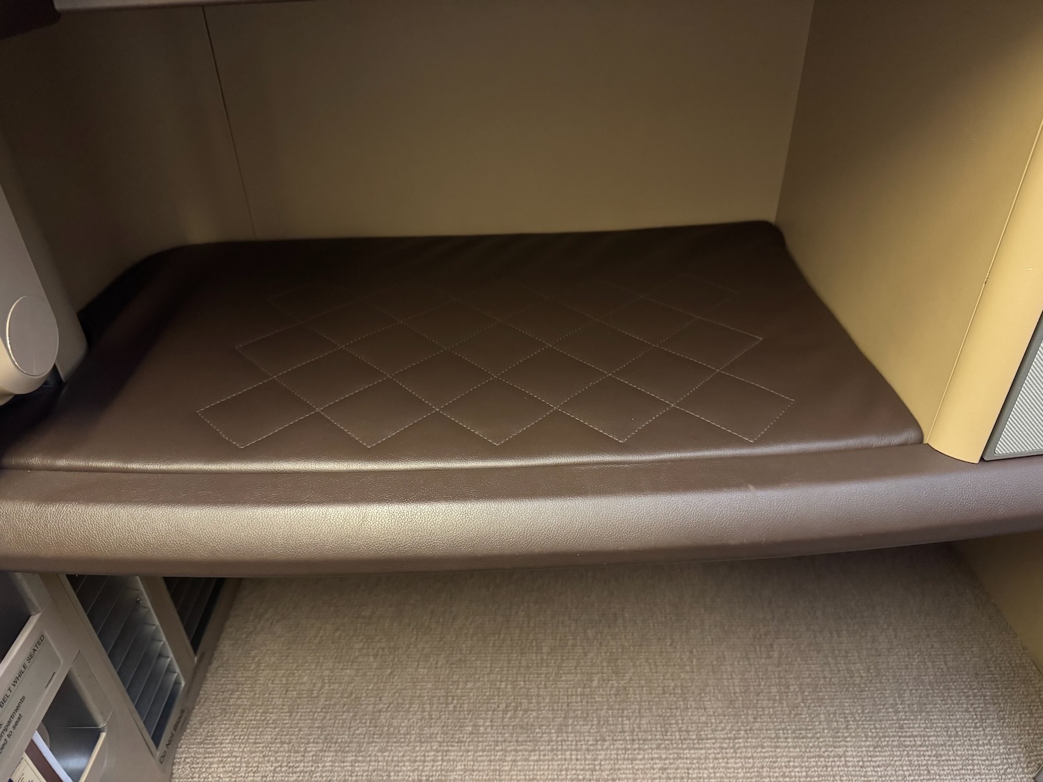 a brown cushion on a shelf