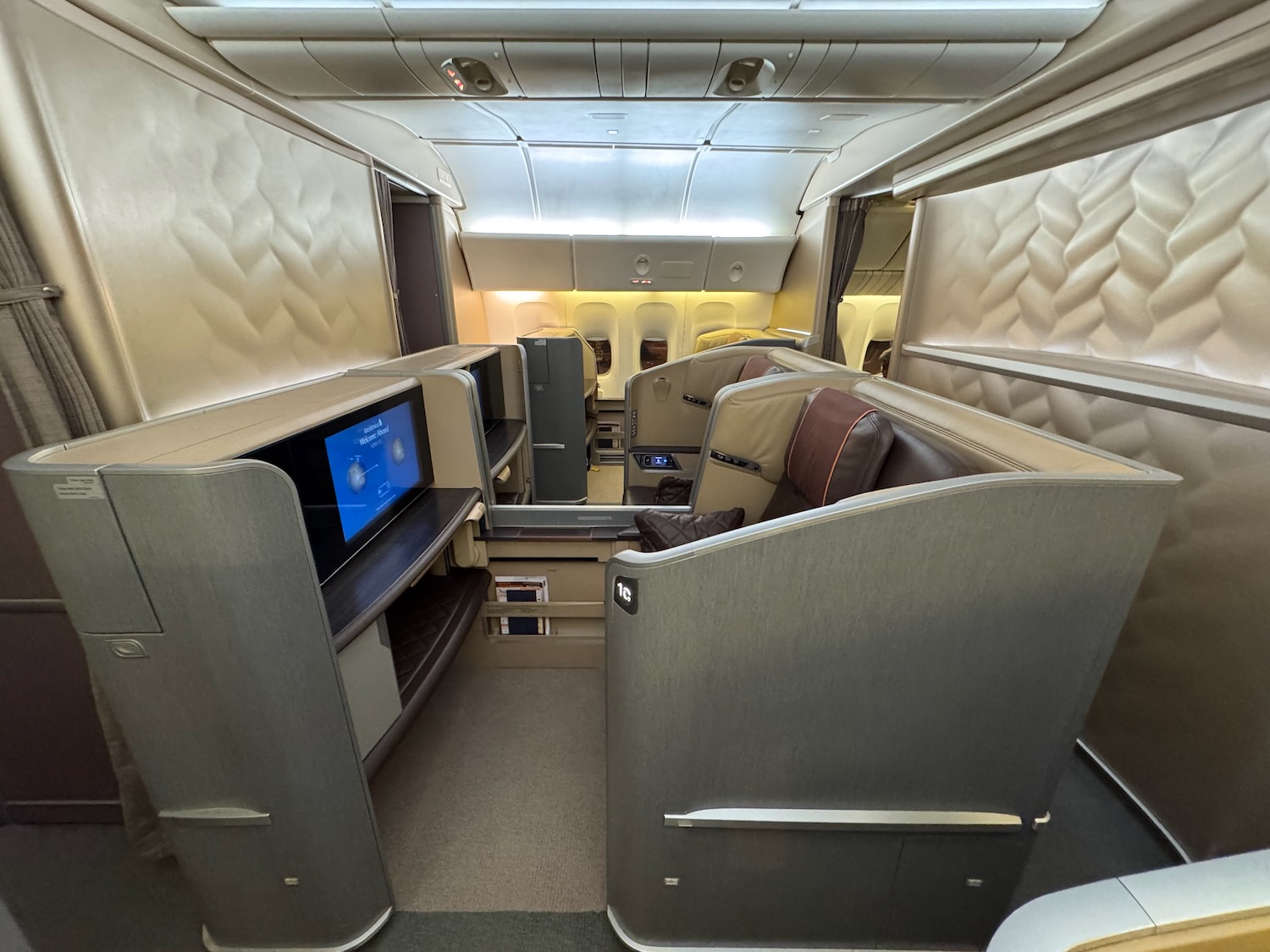 a seat and a television in a plane