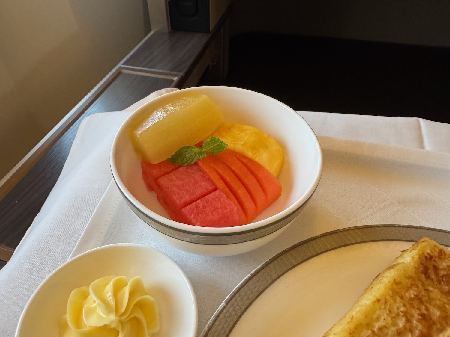 a bowl of fruit on a table