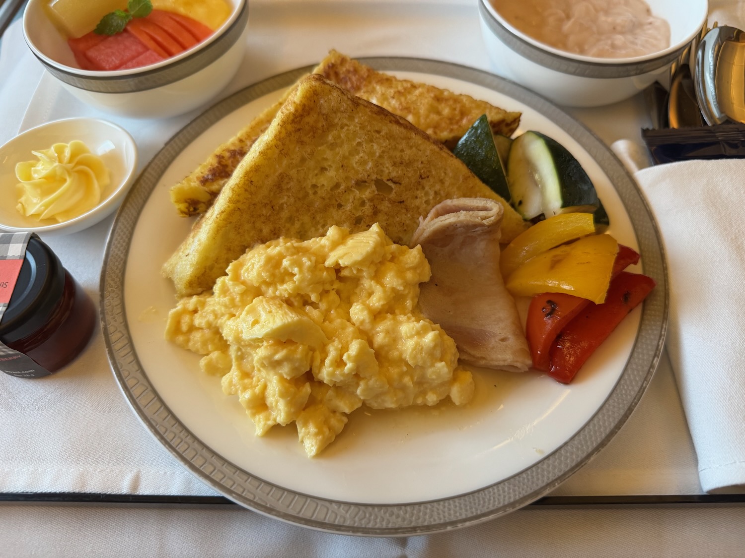 a plate of food with a spoon and fork