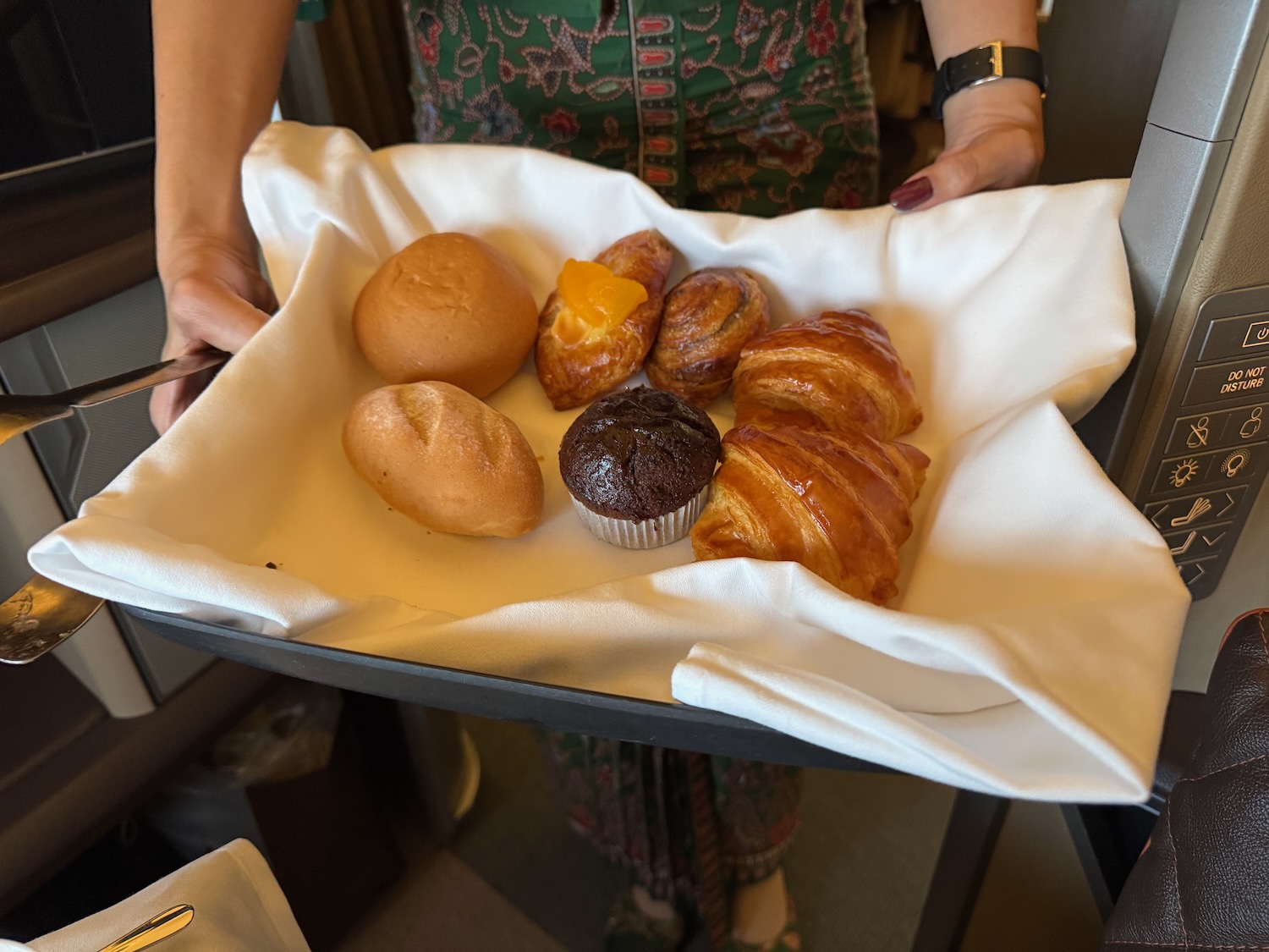 a tray of pastries and muffins