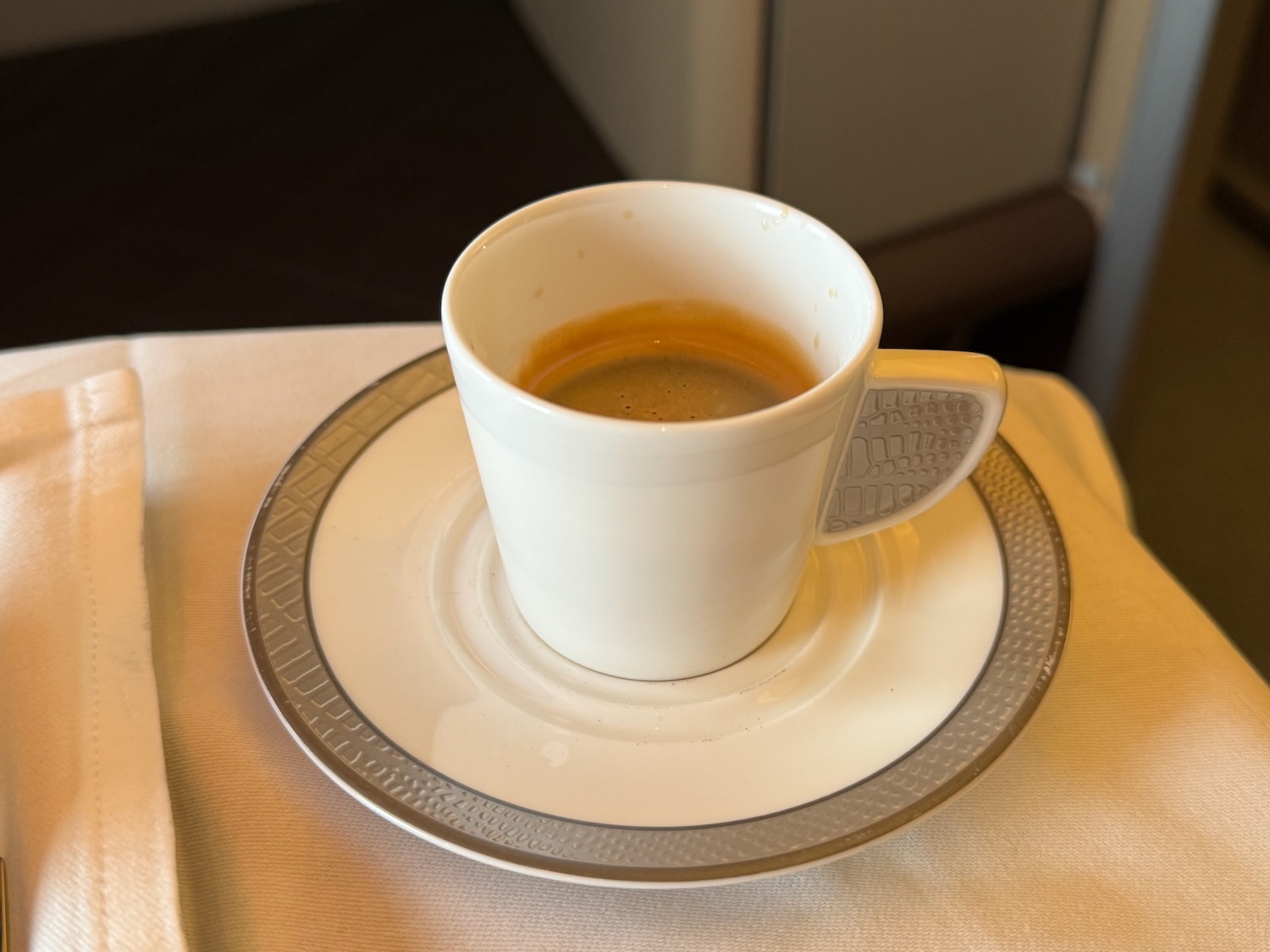 a cup of coffee on a plate